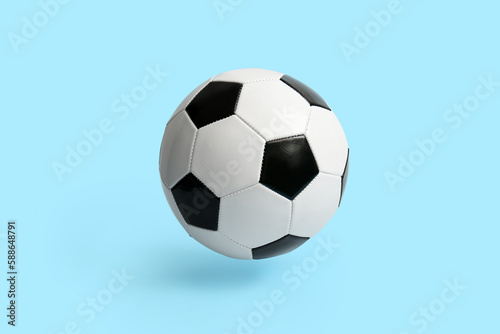 Soccer ball on light blue background