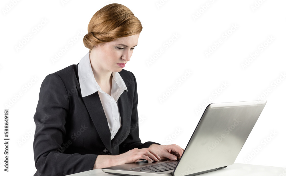 Redhead businesswoman using her laptop Redhead businesswoman using her laptop