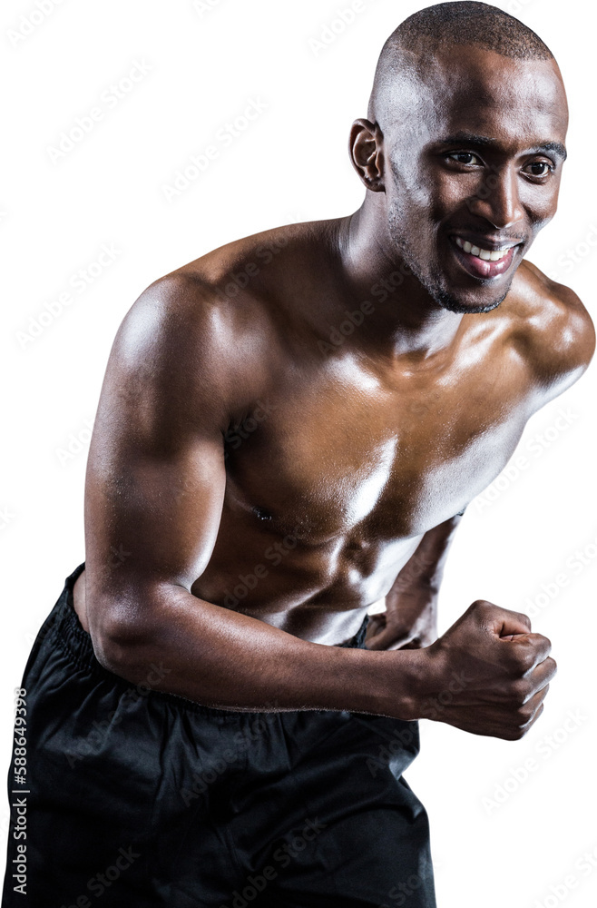 Muscular man smiling while running Muscular man smiling while running