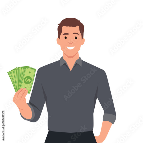 Smiling business man in suit standing holding fan of dollar cash showing money. Happy employee receiving a salary