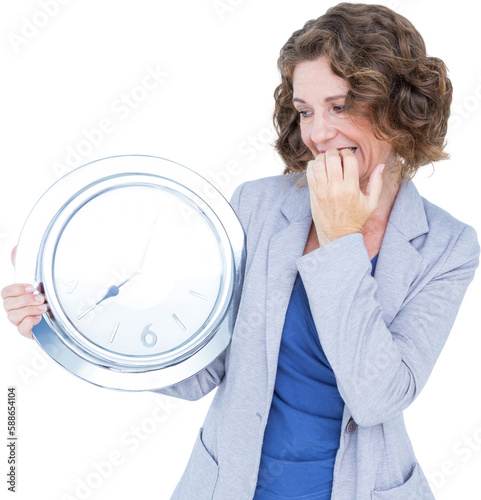Worried businesswoman looking at clock