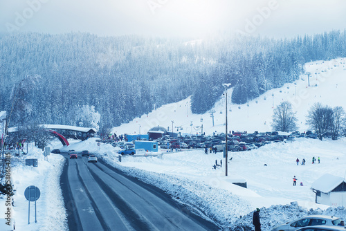 View of ski resort and road during freezing winter.