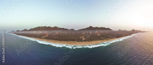 Obraz na płótnie View from above, stunning panoramic view of Cofete beach surrounded by the chain of mountains of the Jandía Natural Park. Fuerteventura, Canary Islands. w salonie