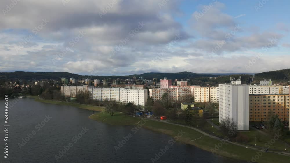 Aerial shot. Housing estate of prefabricated houses near the Mšeno dam in Jablonec nad Nisou and panorama of the Jizera Mountains Aerial shot. Housing estate of prefabricated houses near the Mšeno dam in Jablonec nad Nisou and panorama of the Jizera Mountains