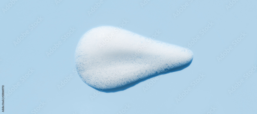 texture foam mousse foam cosmetic smear sample on blue background texture foam mousse foam cosmetic smear sample on blue background