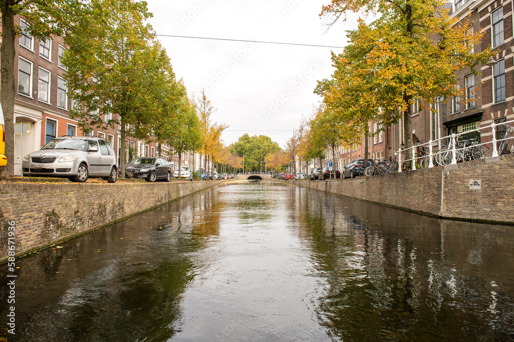 The Netherlands, Delft, October 2022. Canal Oude Delft in Delft canal boat cruise in autumn