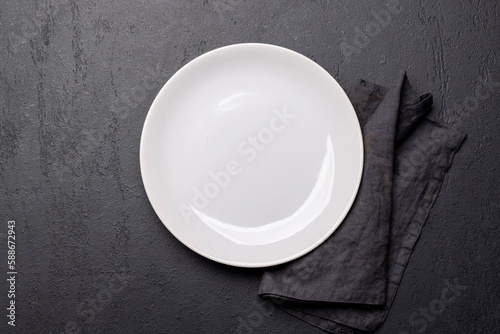 Top-down view of an empty plate and silverware mockup