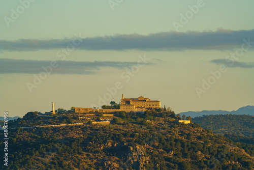 Hermitage of the Virgen de la Cabeza in the sierra of Andujar at dawn with clouds