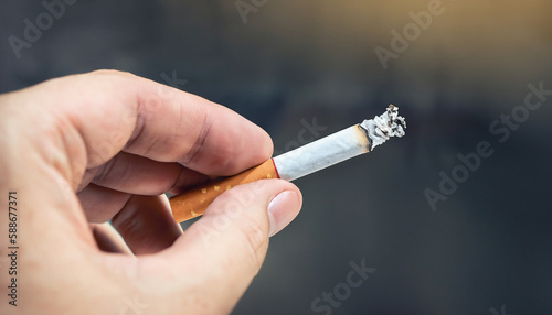 One hand holds a cigarette. Space for text.