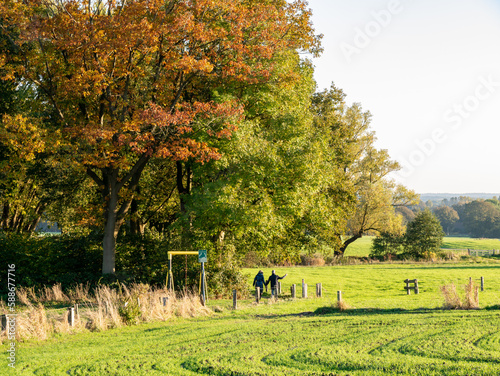 Walkers on footpath through nature near town of Ootmarsum, Overijssel, Netherlands photo