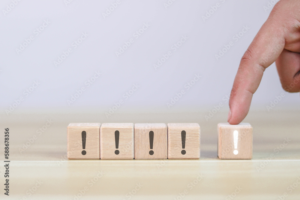 Small wooden block with exclamation mark with highlights and copy space. Small wooden block with exclamation mark with highlights and copy space.