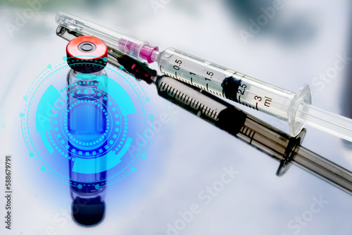Glass ampoules and plastic disposable syringe close up. Medical ampoules. Medical ampoules on a white background with reflections. Injections of beauty