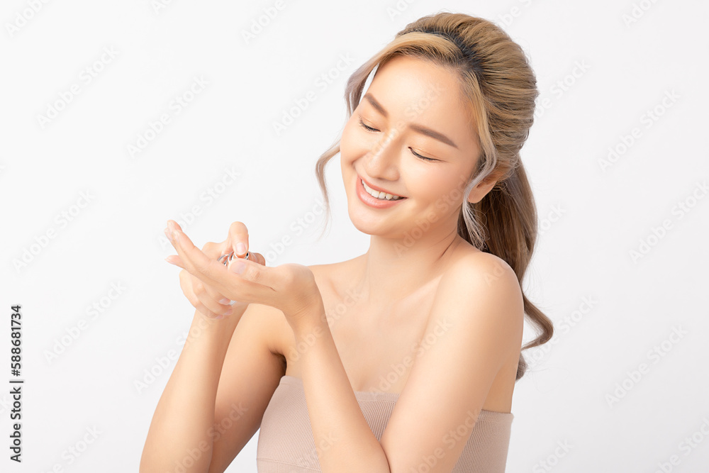 Happy beautiful young asian woman holding cosmetic cream blank bottle, Fashion model, Health wellness, Beautiful girl skin care and facial treatment. Isolated on white background. Happy beautiful young asian woman holding cosmetic cream blank bottle, Fashion model, Health wellness, Beautiful girl skin care and facial treatment. Isolated on white background.