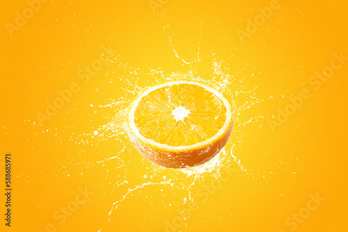 Creative layout made from Fresh Sliced oranges and Orange fruit and water Splashing on a orange background.