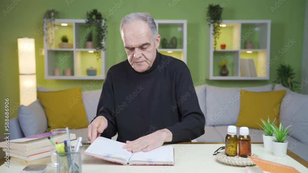 The old man, taking notes in the old diary, cries.
The old man who takes notes in an old diary starts to cry and closes the notebook.
The old man, taking notes in the old diary, cries.
The old man who takes notes in an old diary starts to cry and closes the notebook.