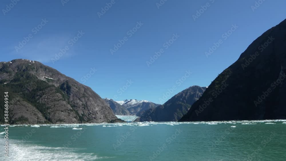 Beautiful view of the Glacier Bay National Park in Alaska with snowy rocks in the background Beautiful view of the Glacier Bay National Park in Alaska with snowy rocks in the background