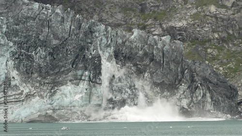 Beautiful view of a glacier calving into a lake on a cloudy day