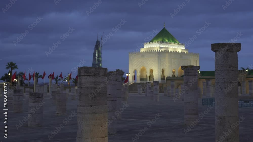 Scenic view of illuminated Mausoleum of Mohammed V landmark on dark blue sky background Scenic view of illuminated Mausoleum of Mohammed V landmark on dark blue sky background