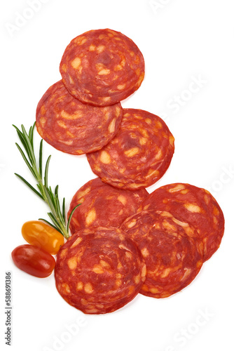 Spanish pork chorizo sausage slices, close-up, isolated on white background.