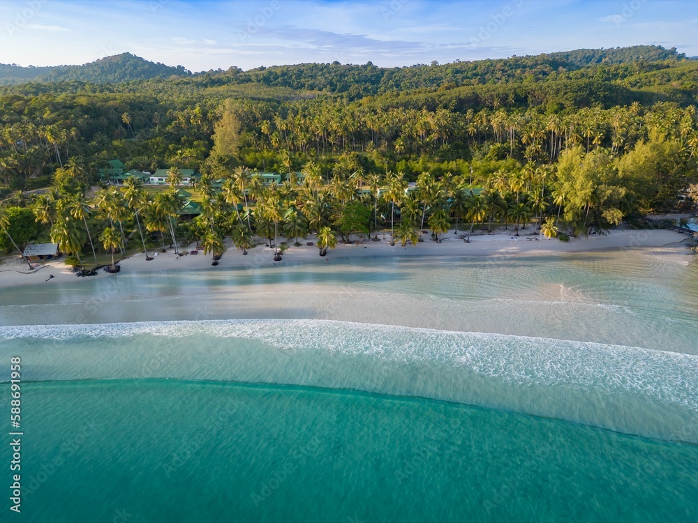Aerial shot of the Ao Khlong Hin beach on Koh Kood island in Thailand surrounded by the blue sea