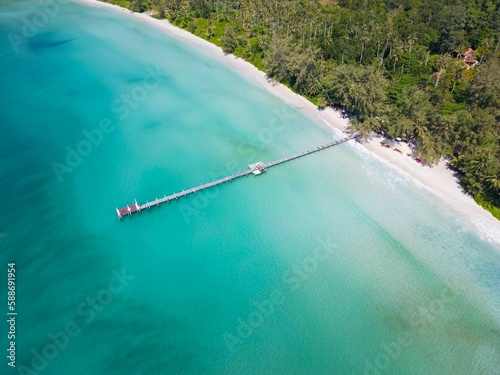 Aerial shot of the Ao Phrao beach on Koh Kood island in Thailand surrounded by the blue sea photo