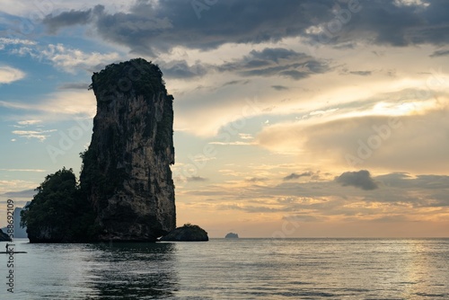 Huge stack at the Pai Plong Beach with sunset and the horizon in the background in Krabi, Thailand