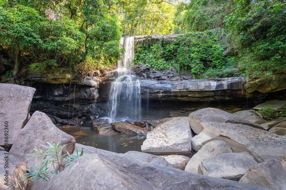 Naklejka premium Foamy Huang Nam Keaw Waterfall in Koh Kood, Thailand surrounded by the green trees
