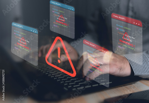 Computer hack warning,System hacked warning alert on notebook (Laptop),cyber security concept,The danger of malware viruses,ransomware virus,triangle caution warning sign notification error..