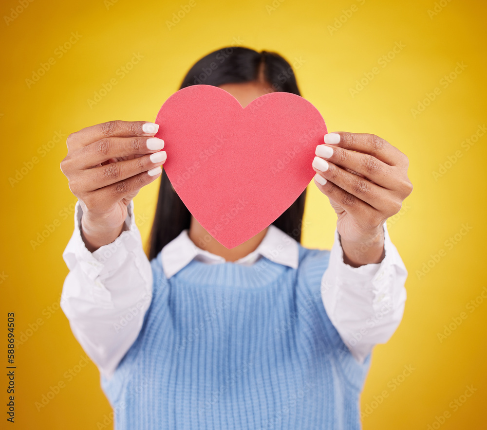Cover, paper and heart with woman in studio for love, support and romance. Valentines day, kindness and date with female hiding with symbol on yellow background for health, happiness and hope mockup Cover, paper and heart with woman in studio for love, support and romance. Valentines day, kindness and date with female hiding with symbol on yellow background for health, happiness and hope mockup