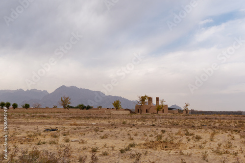 Low- angle view of Sar Yazd Castle (Saryazd) ancient clay fortress in Yazd Province, Iran photo