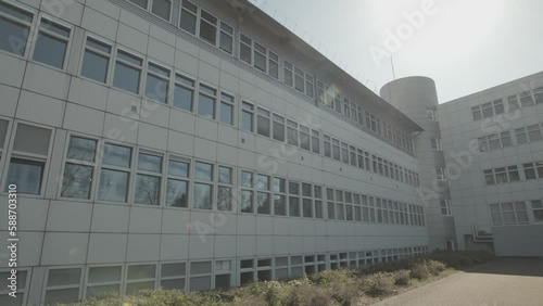 Front of a building with windows and tree