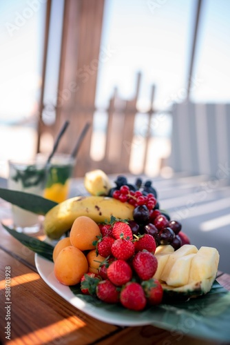 Platter of fruits on a plate in the table