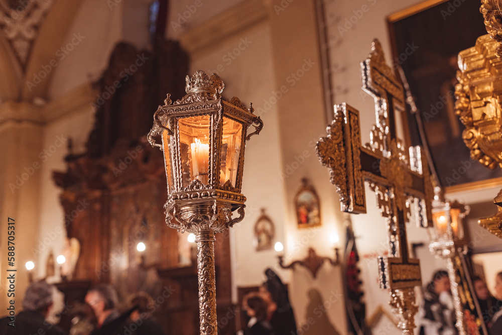 Cross and lighted lantern inside a church Cross and lighted lantern inside a church