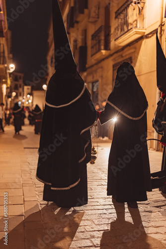 Penitents on their backs with incense burner