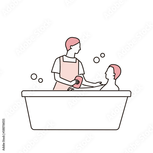 入浴する男性と介助する介護福祉士