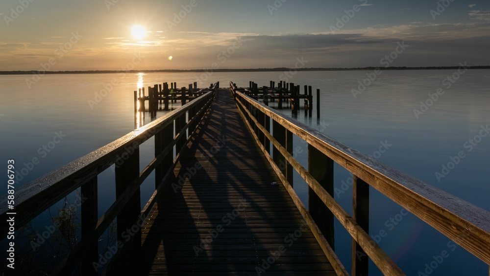 Sunrise scenery from peaceful wooden pier