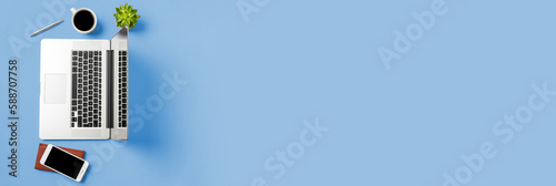 Office desktop with laptop and accessories