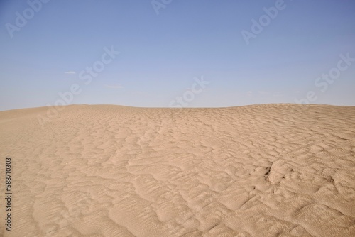Fototapeta Naklejka Na Ścianę i Meble -  Daytime view of sand dunes in a desert
