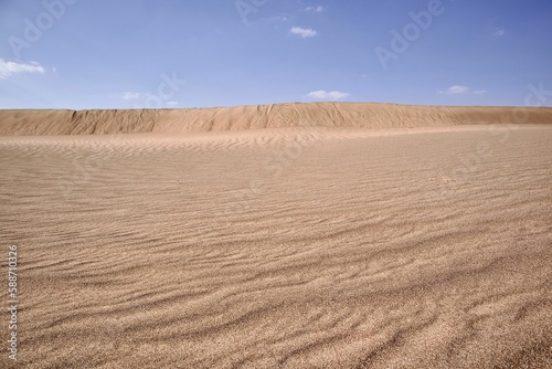 Fototapeta Naklejka Na Ścianę i Meble -  Daytime view of sand dunes in a desert