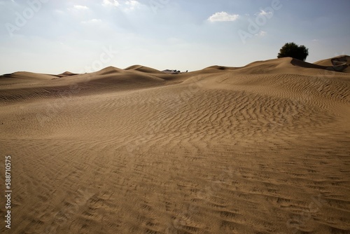 Fototapeta Naklejka Na Ścianę i Meble -  Beautiful shot of a dry brown desert under a bright blue sky