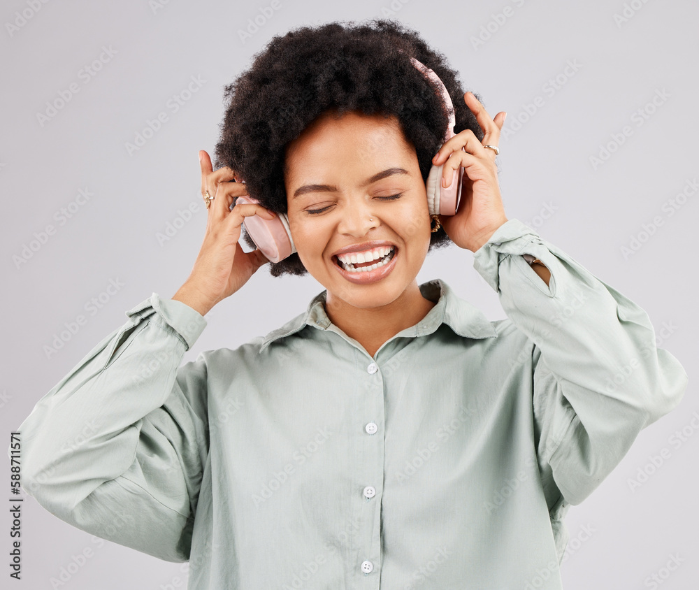 Music headphones, black woman and singing in studio isolated on a white background. Singer, radio and happiness of person listening, streaming or enjoying audio track, sound album or podcast song. Music headphones, black woman and singing in studio isolated on a white background. Singer, radio and happiness of person listening, streaming or enjoying audio track, sound album or podcast song.