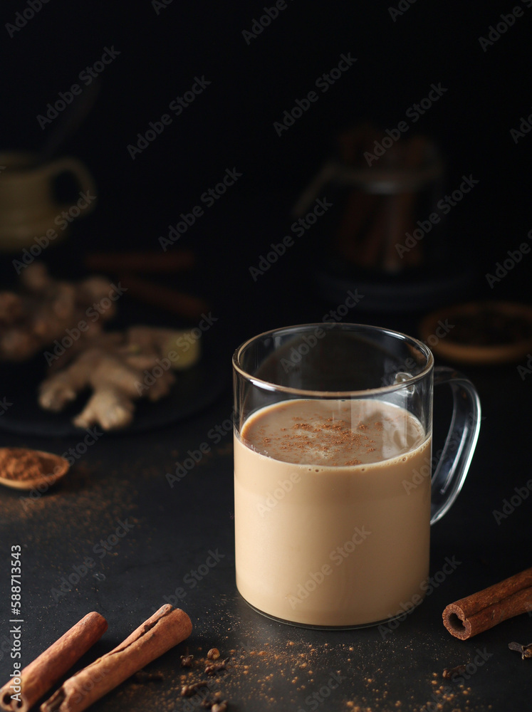 A cup with masala chai in low key A cup with masala chai in low key