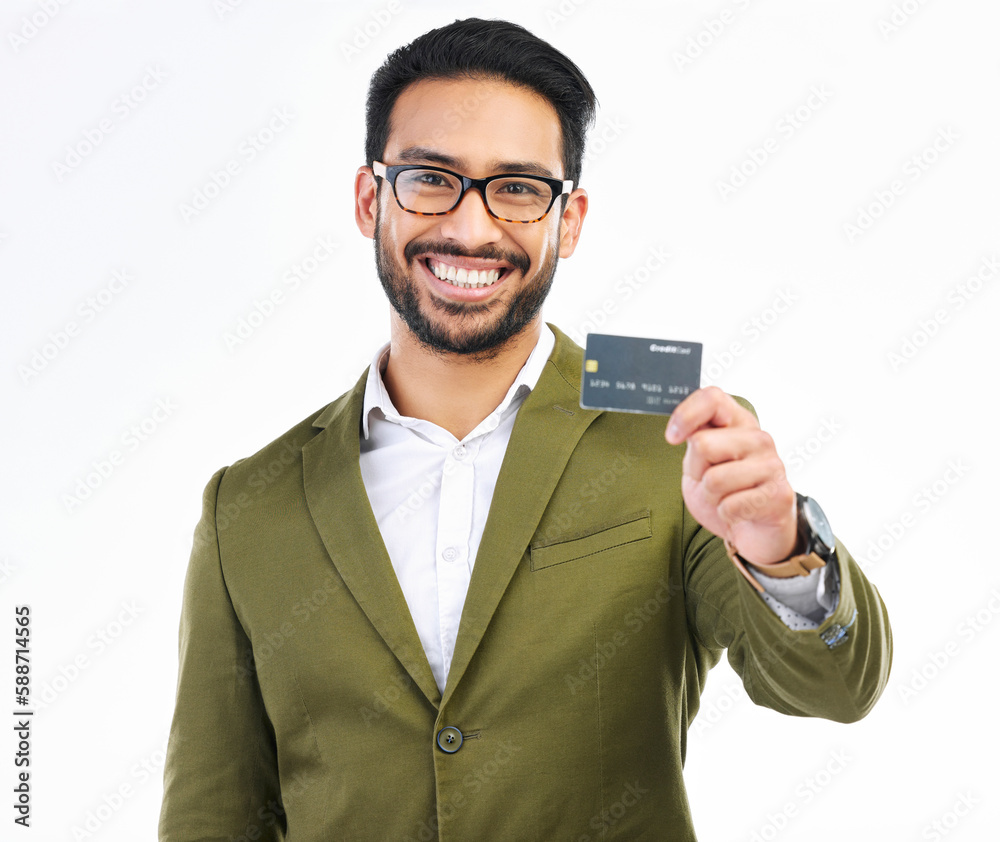 Smile, credit card and portrait of man in studio with happy financial freedom and security savings. Happiness, Indian businessman with banking and saving by investing in small business startup budget Smile, credit card and portrait of man in studio with happy financial freedom and security savings. Happiness, Indian businessman with banking and saving by investing in small business startup budget