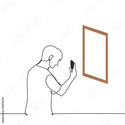 man photographs his reflection in the mirror or a picture in the gallery with his phone - one line drawing vector. concept to take a selfie or photograph an exhibit or masterpiece of art