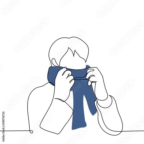 man adjusting his scarf - one line drawing vector. concept to dress warmly, cold snap or autumn winter season