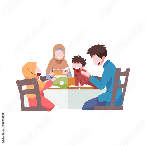 A family having a meal together during eid al fitr