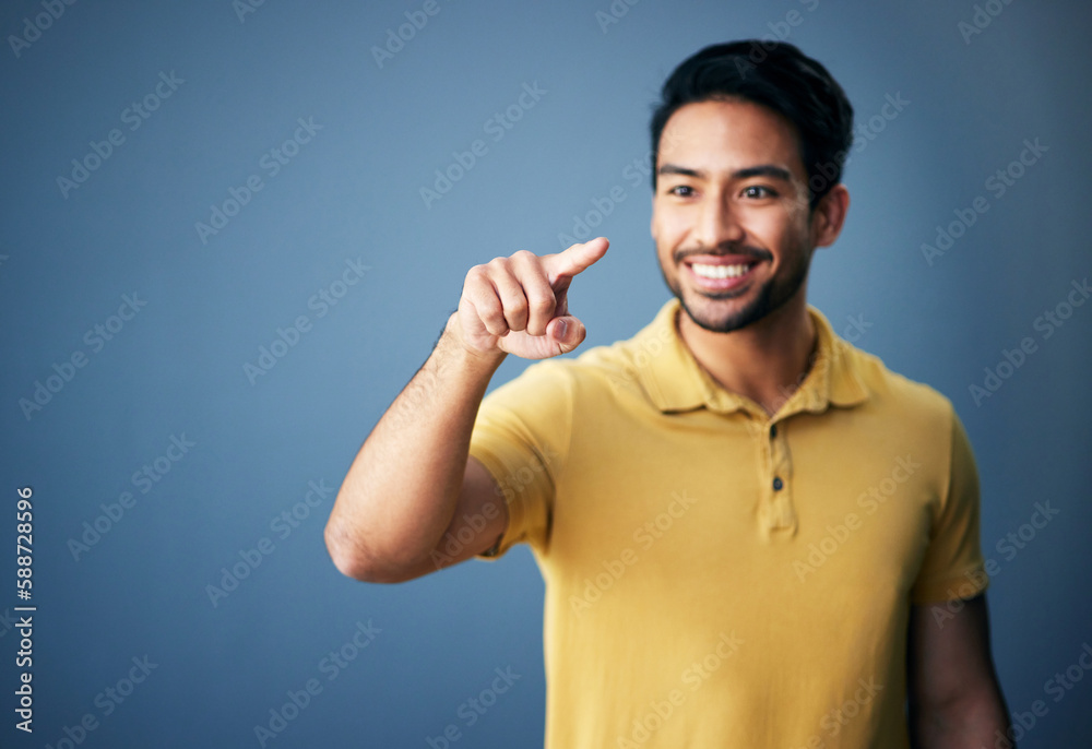 Happy, finger and man in studio with hand for mockup space or ai on a blue background. Smile of an asian male model person pointing for product placement and creative brand isolated for gradient logo Happy, finger and man in studio with hand for mockup space or ai on a blue background. Smile of an asian male model person pointing for product placement and creative brand isolated for gradient logo