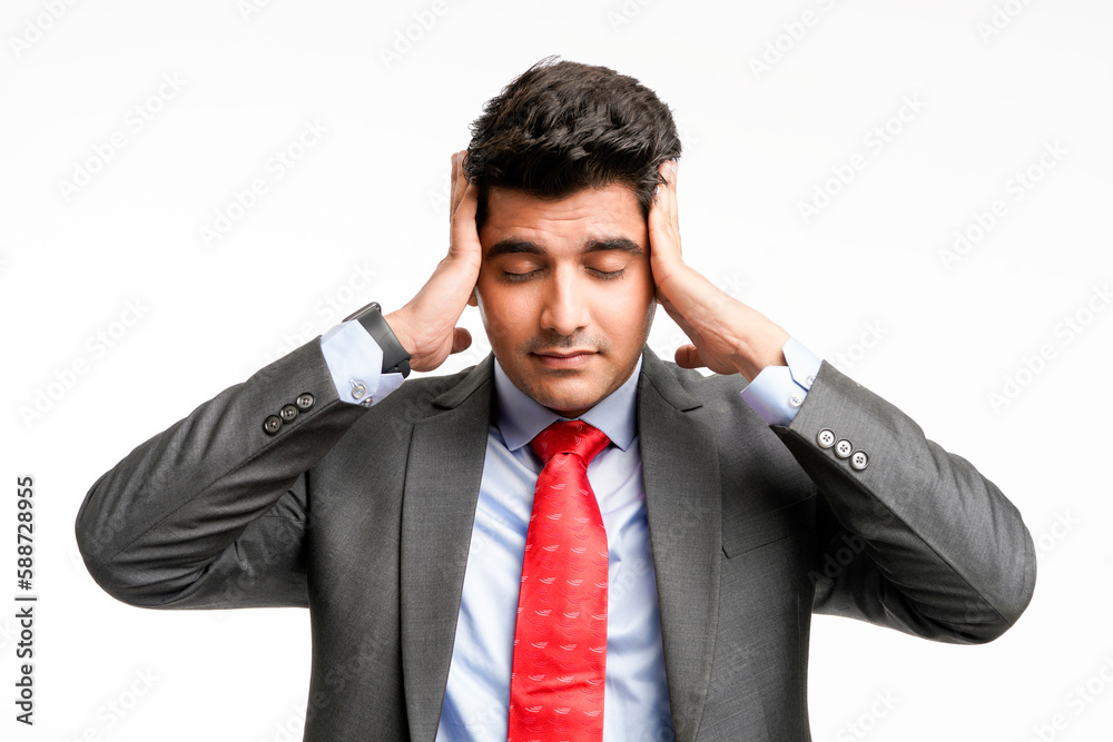 Young indian Stressed businessman with hands on head on white background. Young indian Stressed businessman with hands on head on white background.