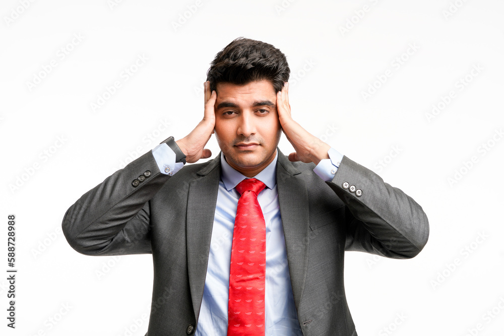 Young indian Stressed businessman with hands on head on white background. Young indian Stressed businessman with hands on head on white background.