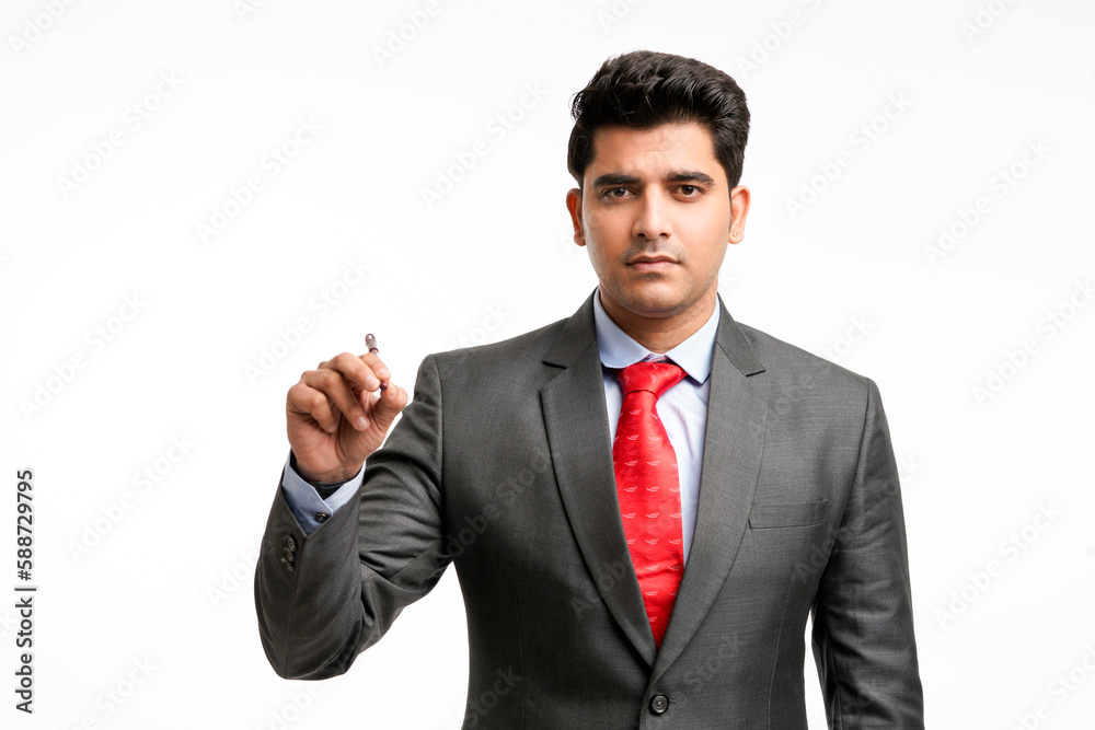 Young businessman pointing in front of with pen Young businessman pointing in front of with pen